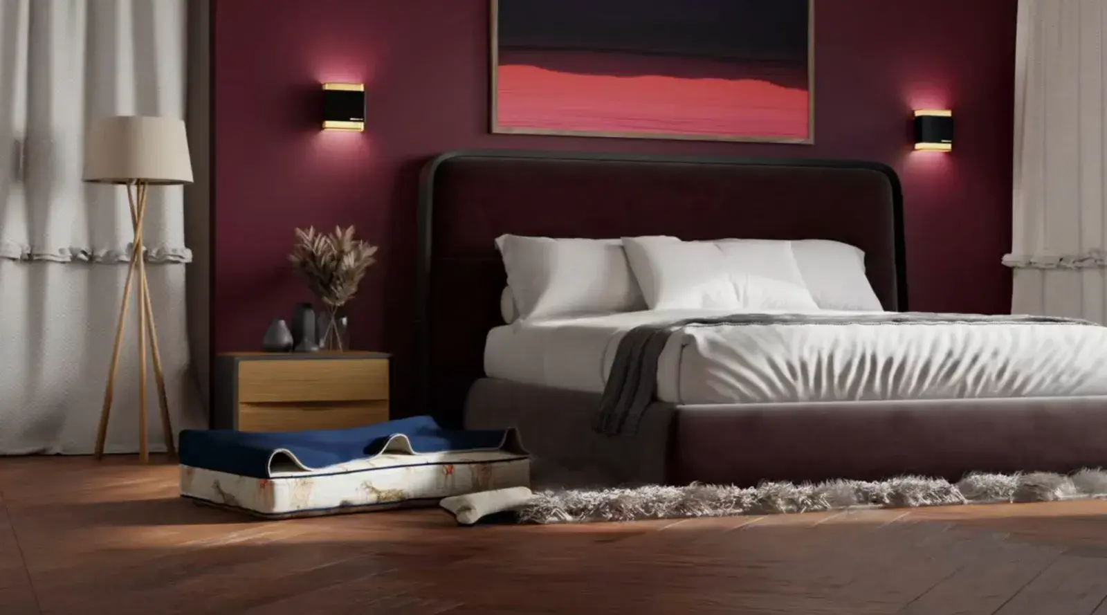 A Cave Dog Bed with a navy hood beside a bed in a burgundy bedroom