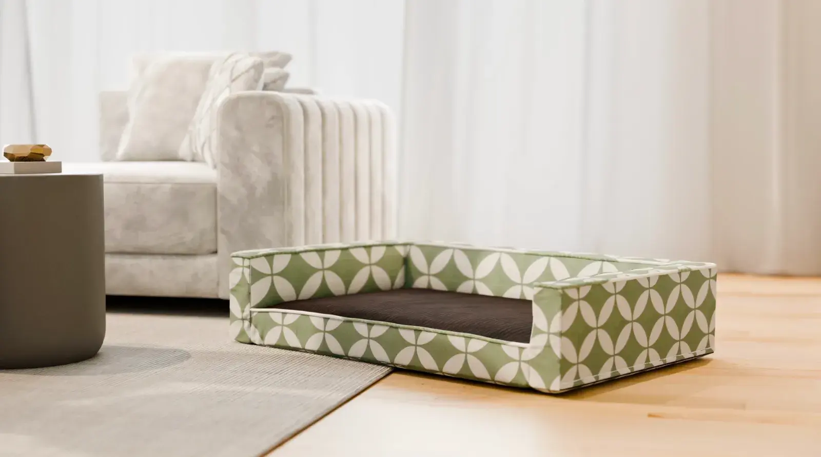 An Edgy Bed in a green and white circle print beside a sofa
