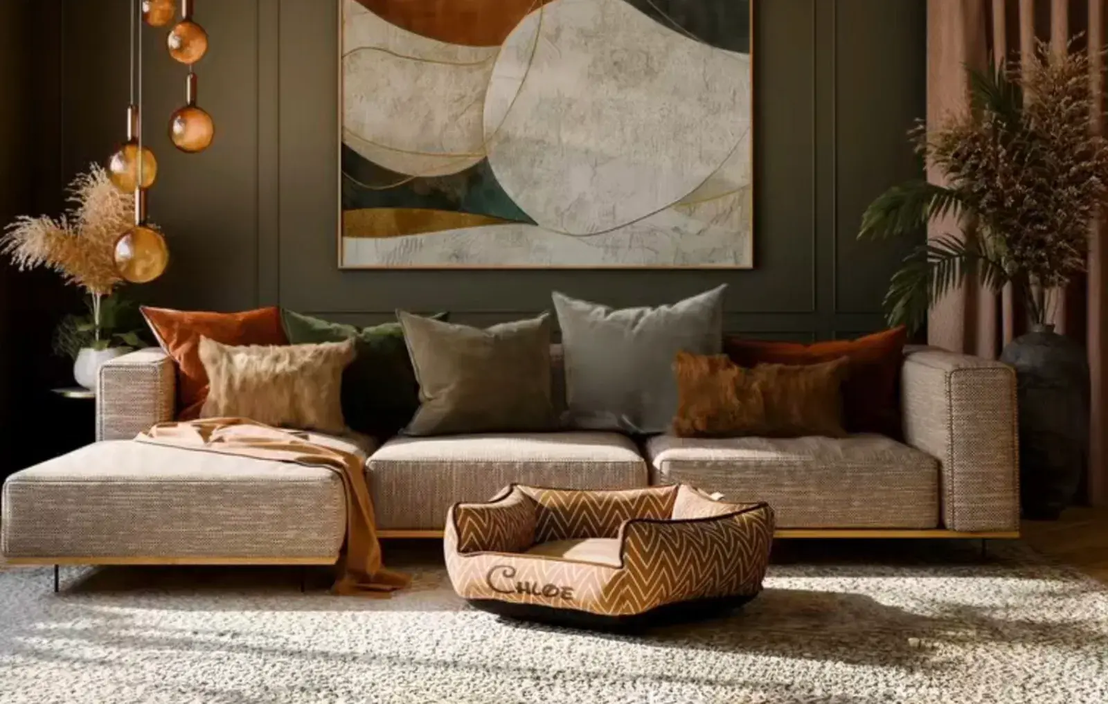 A Penthouse Bed in a tan chevron, embroidered Chloe, in front of a sofa