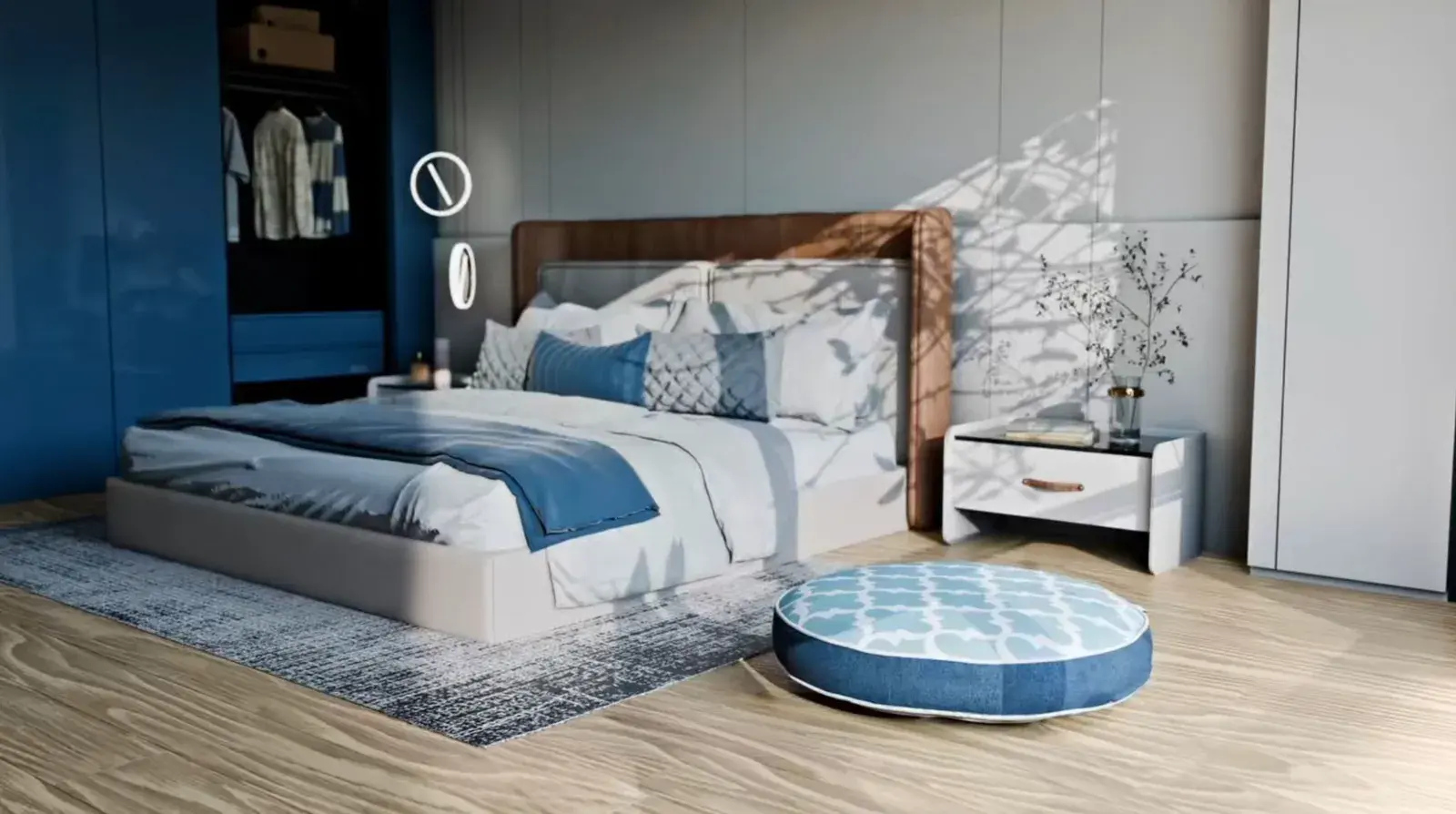 A Round Bed in blue quatrefoil at the foot of a bed