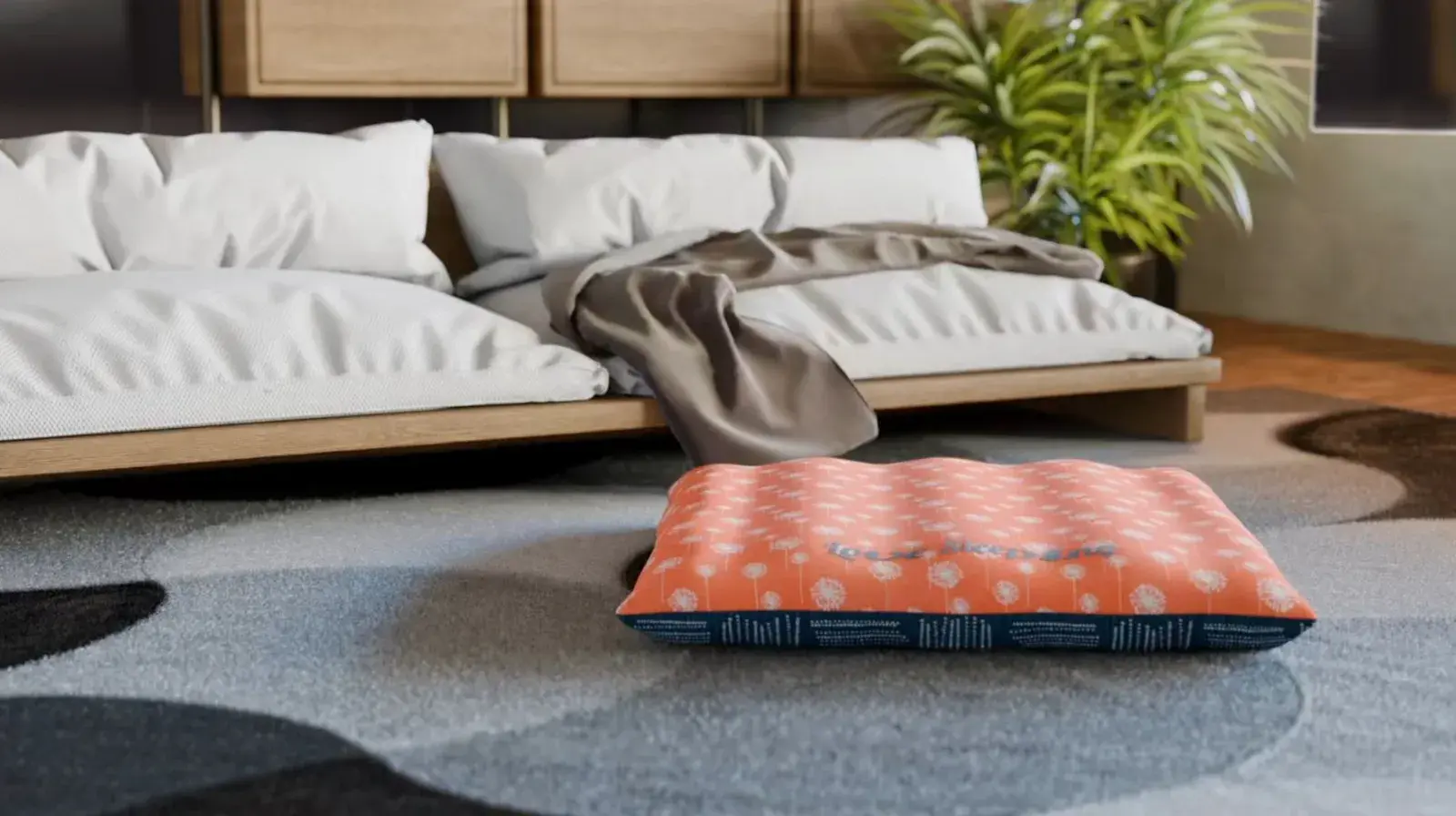 A Pillow Bed in orange dandelion with a navy band on a grey rug