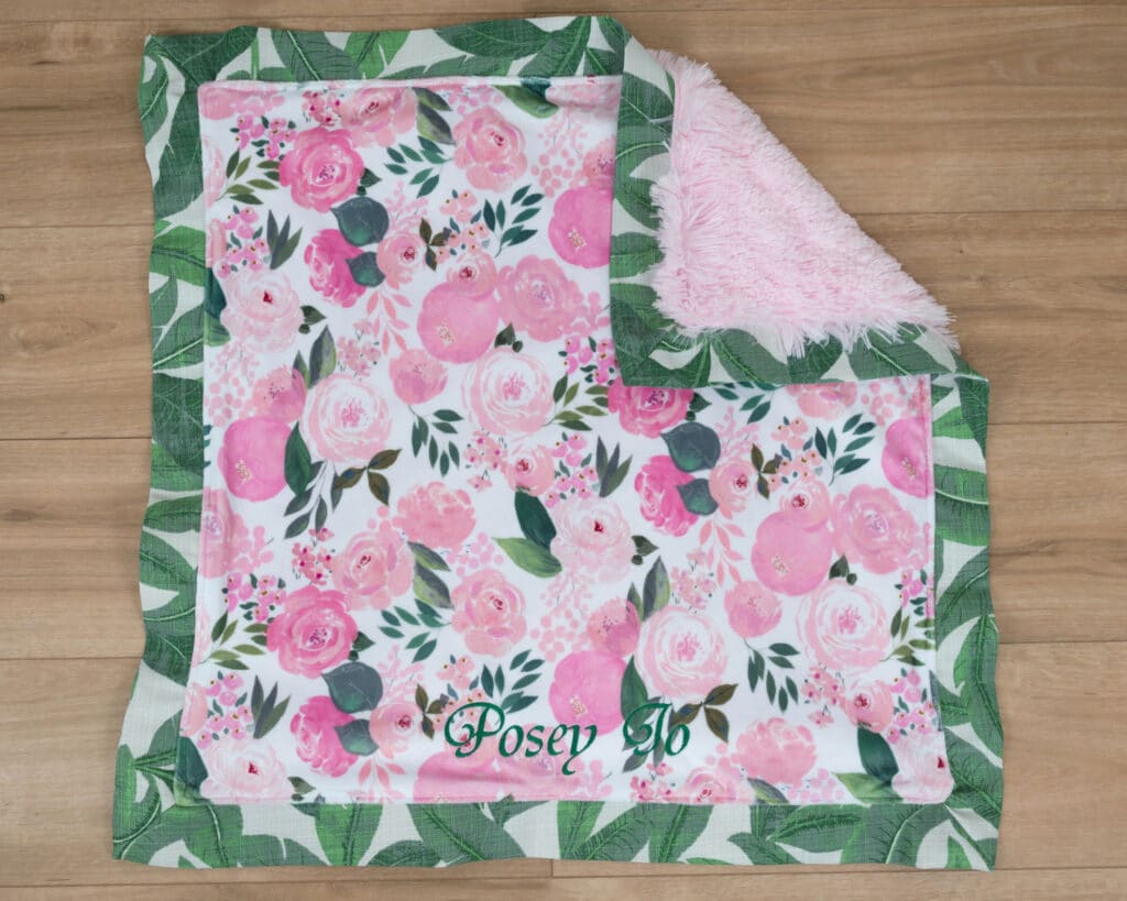 light pink and green floral blanket