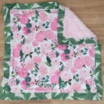 light pink and green floral blanket