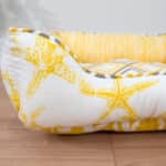 x-small nautical dog bed with yellow starfish close up