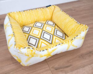 x-small nautical dog bed with yellow starfish