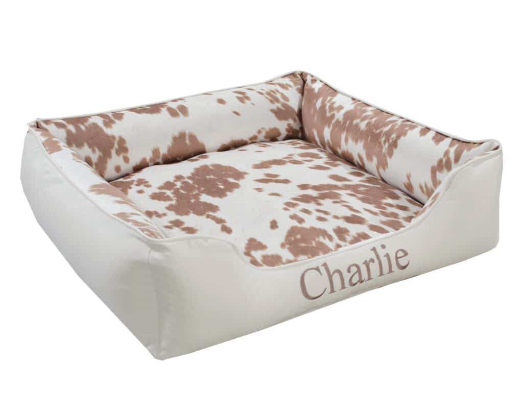 palomino faux cowhide dog bed with bolsters and embroidery