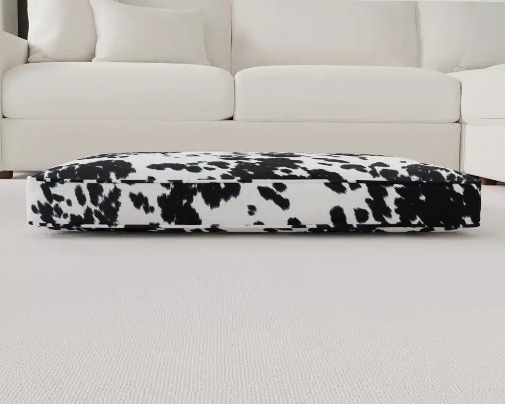 black and white faux cowhide dog bed cushion front